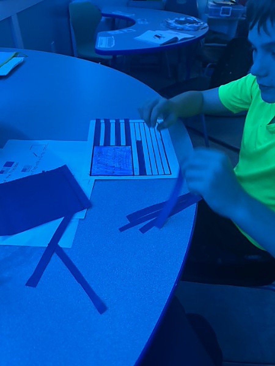 A participant working on a hands-on craft project