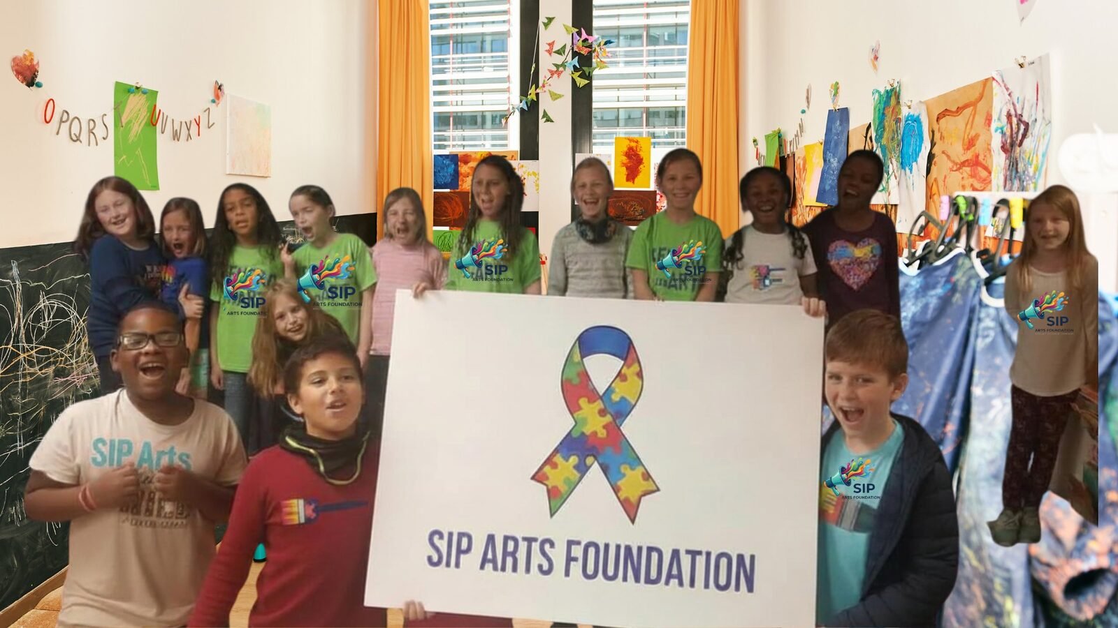 Children in SIP Arts Foundation shirts holding a SIP Arts Foundation sign in an art-filled classroom