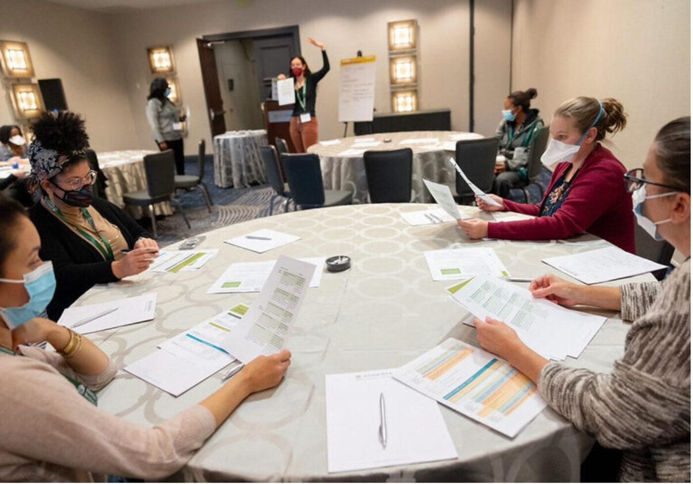 Parents and caregivers working through advocacy materials at a SIP workshop table